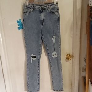 Woman's very distressed jeans blue. Size 29. Buffalo.